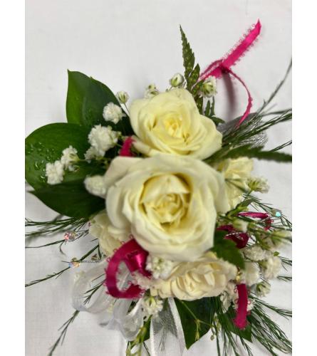 White and Pink Wrist Corsage. An arrangement by Ada's Flowers.