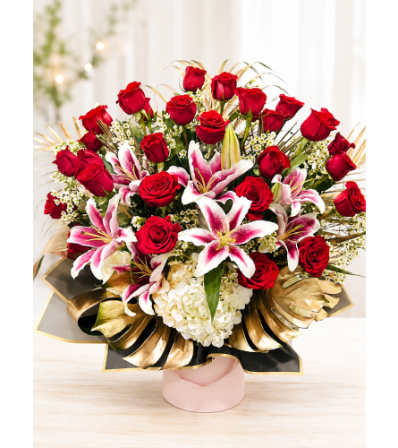 Roses and lilies in the box - Deluxe. An arrangement by Floral Lady Design Studio LLC.
