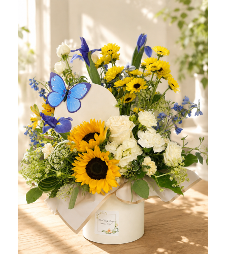 Blue Skies and Golden Rays. An arrangement by Floral Lady Design Studio LLC.