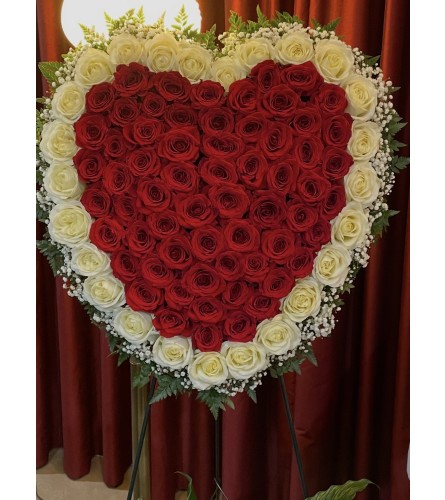 Forever in my heart standing tribute. An arrangement by Tom's Florist.