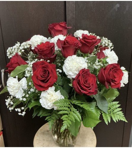 Oh Canada Vase. An arrangement by Roma Flowers and Gifts.