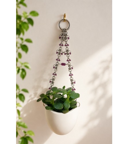 GEM CHAIN HANGING WALL PLANTER. An arrangement by Fink Flowers Gifts and Flower Delivery.