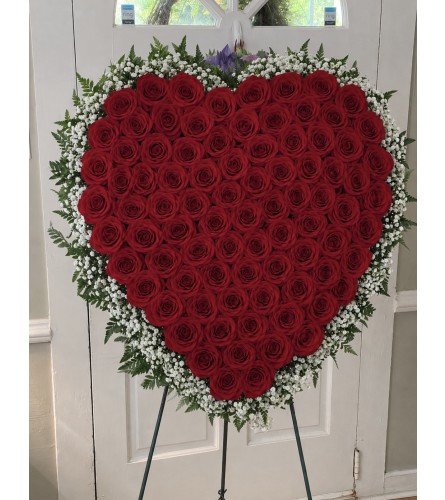 Red Rose Heart Standing Spray. An arrangement by Tom's Florist.