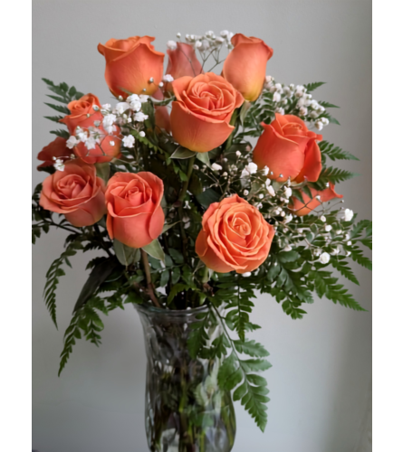 A Dozen Orange Roses. An arrangement by Osborne Florist.