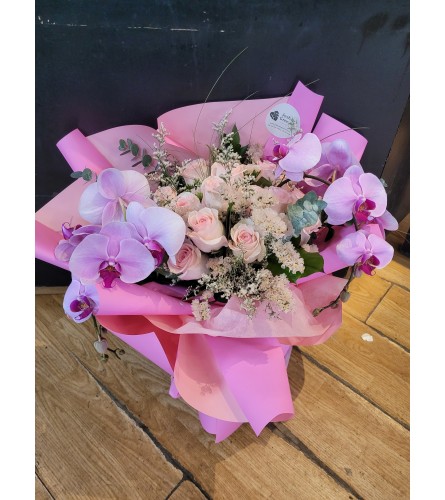 Blush Orchid bouquet. An arrangement by Sophie's Flowers.