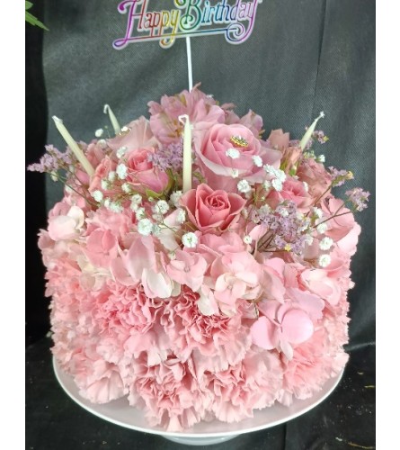 Tender Pink Birthday Wishes -Cake. An arrangement by Howard Beach Florist.