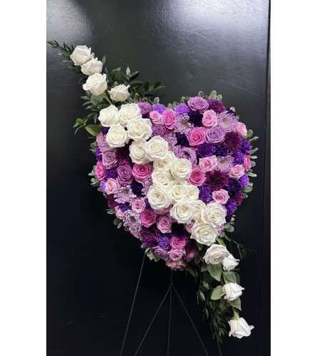 Marivel's Eternal Love and Light. An arrangement by Marivel's Florist and Gifts.