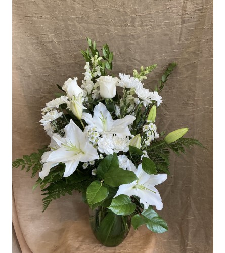 Whispering White. An arrangement by Roma Flowers and Gifts.