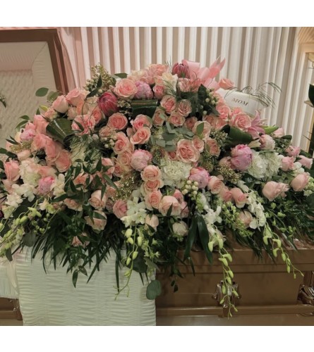 Pure Grace Floral Tribute Casket Spray - Deluxe. An arrangement by Berlin Flower Shop.