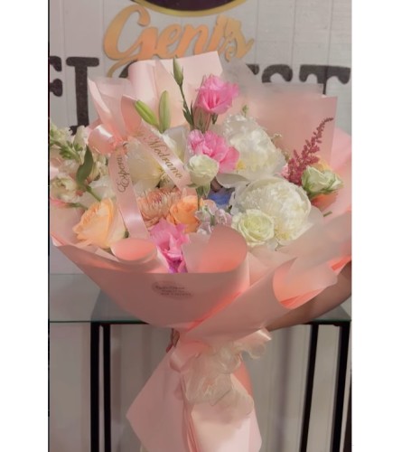 Blush Whisper Bouquet - Deluxe. An arrangement by Geni's Florist and Gifts.