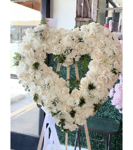 White Serenity Heart. An arrangement by Flower World and Gifts.