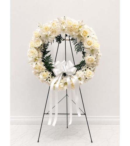 Serene White Sympathy Wreath (26). An arrangement by Queens Flowers.