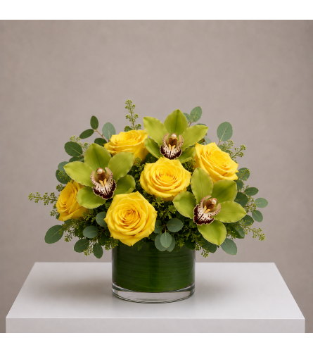 Sunlit Orchid Embrace - Standard. An arrangement by Bill's Flowers Arrangements.