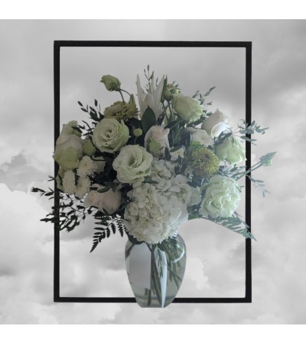 Whispering White Elegance. An arrangement by Flowers by Nancy Joslin.