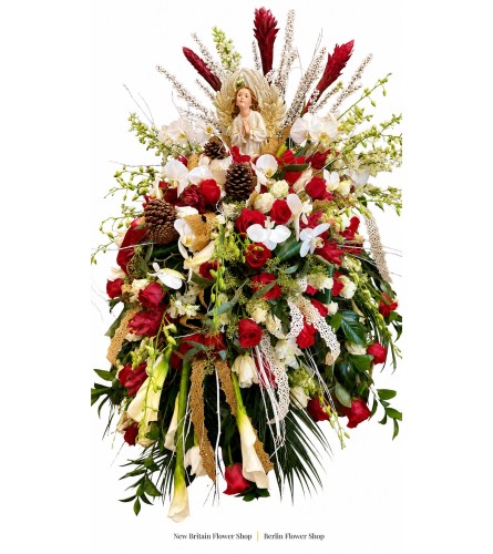Angel’s Grace Tribute - Deluxe. An arrangement by New Britain Flower Shop.