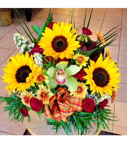 Warmth and Whimsy - Deluxe. An arrangement by Avenue Florist.