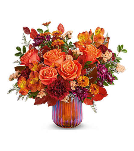 Teleflora's Amber Glow Bouquet - Deluxe. An arrangement by Marivel's Florist and Gifts.
