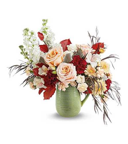 Teleflora's Pour It On Bouquet - Deluxe. An arrangement by Marivel's Florist and Gifts.