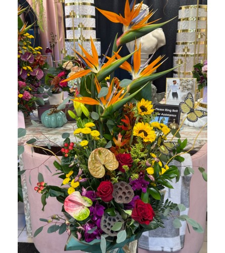 Tropical Radiance Arrangement - Deluxe. An arrangement by Berlin Flower Shop.