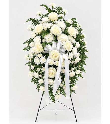 Pure Serenity Standing Spray. An arrangement by Queens Flowers.