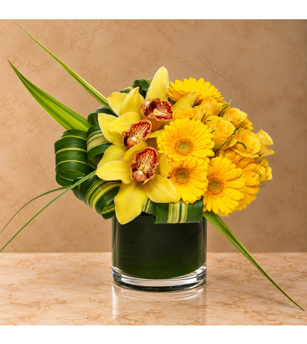 Sunburst. An arrangement by Bill's Flowers Arrangements.