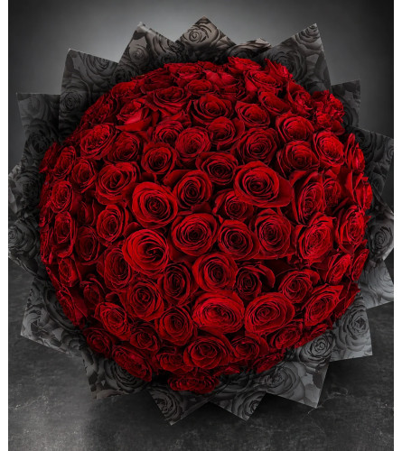 RAMO BUCHON - Deluxe. An arrangement by Daisy's Flower Shop.