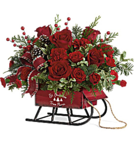 Teleflora's Rosy Sleigh Bouquet - Deluxe. An arrangement by Marivel's Florist and Gifts.
