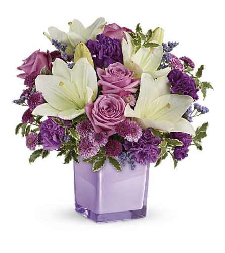 The Teleflora's Pleasing Purple Bouquet - Deluxe. An arrangement by Marivel's Florist and Gifts.