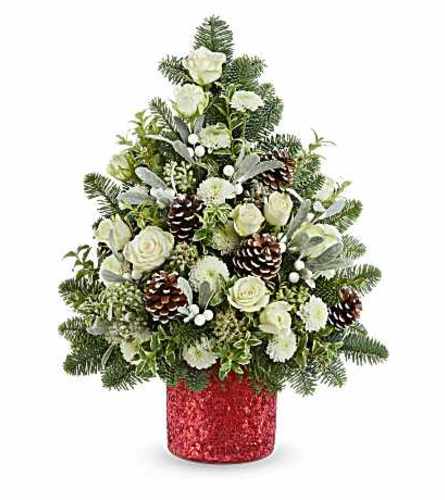 The Teleflora's Winter Whisper Tree - Deluxe. An arrangement by Marivel's Florist and Gifts.