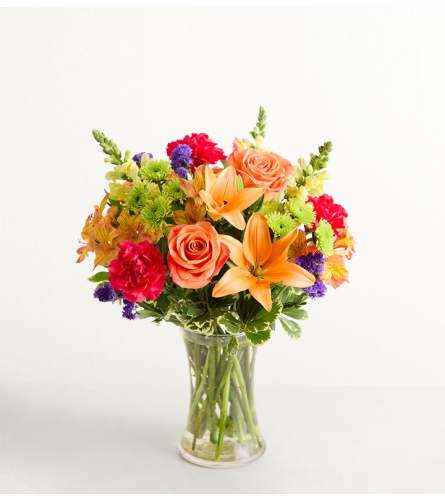 The Vibrant Floral Medley™ - Deluxe. An arrangement by Flowers of Charlotte.