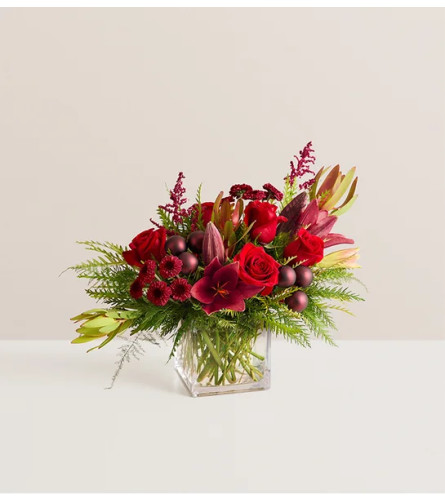 Crimson Carol™ - Deluxe. An arrangement by Flowers of Jacksonville.