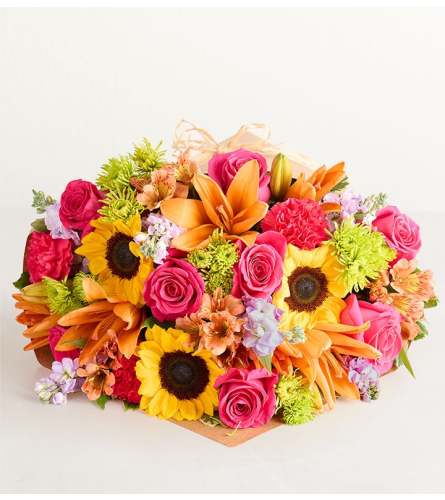 The Floral Embrace Wrapped Bouquet - Extra Large. An arrangement by Flowers of Jacksonville.