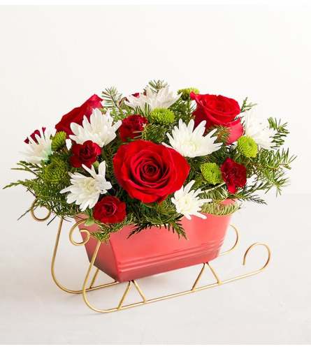 Dashing Through the Snow Sleigh™ - Deluxe. An arrangement by Flowers of Jacksonville.