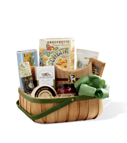 The FTD® Heartfelt Sympathies™ Basket - Standard. An arrangement by Believe Flowers.