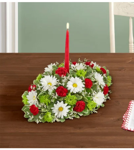Seasons Greeting™ Centerpiece - Standard. An arrangement by Flowers of Jacksonville.