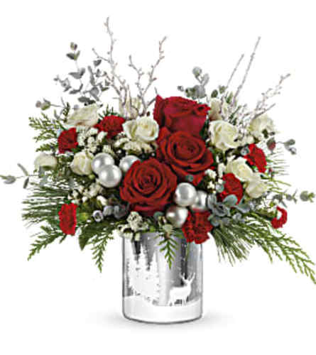 Teleflora's Wintry Wishes Bouquet - Deluxe. An arrangement by Marivel's Florist and Gifts.