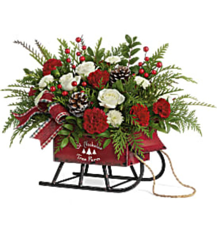 Teleflora's Sleigh Bells Bouquet 2020 - Standard. An arrangement by Wasaga Flowers.