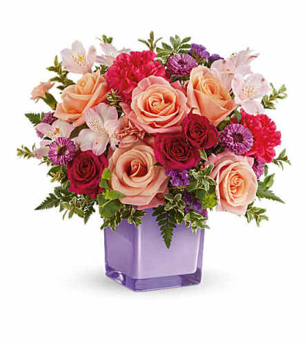 The Teleflora's Sunset Sorbet Bouquet - Deluxe. An arrangement by Marivel's Florist and Gifts.