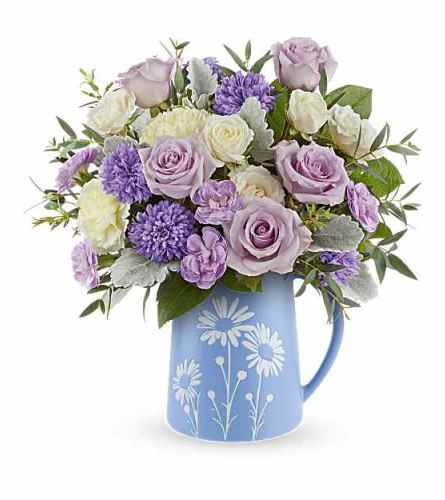 The Teleflora's Daisy Haze Bouquet - Deluxe. An arrangement by Marivel's Florist and Gifts.