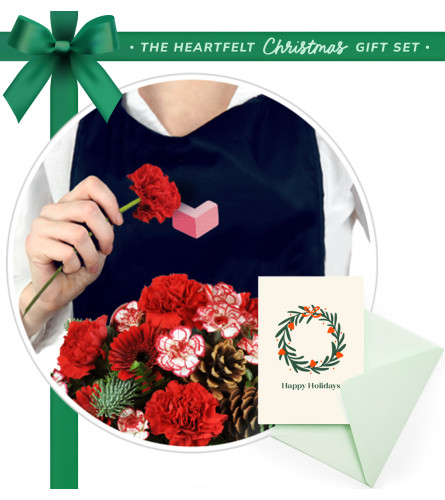 Very Merry Bouquet and Greeting Card Bundle. An arrangement by Marianne's Floral Garden. Your stunning Christmas flowers include the designer's...