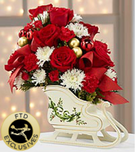 Holiday Traditions. An arrangement by Shalimar Flower Shop.