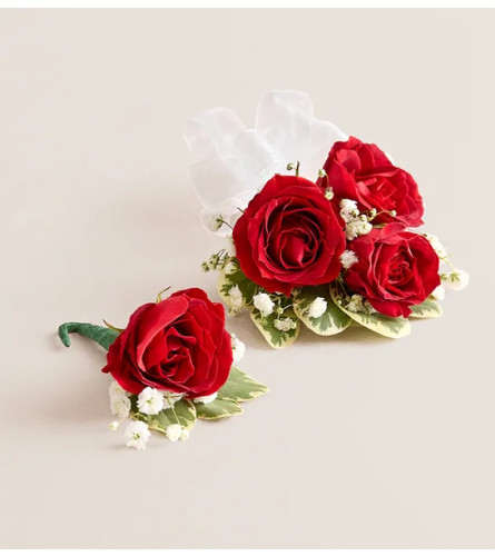 Red Spray Rose Corsage and Boutonniere - Standard. An arrangement by Sicola's Florist. Please be sure to specify your desired ribbon color in the...