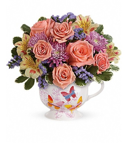 Teleflora's Butterfly Sunrise Bouquet - Standard. An arrangement by GardeLina Flowers.