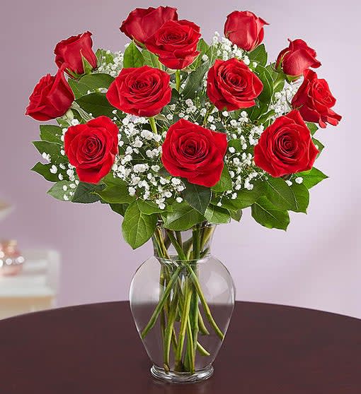 1 DOZEN RED ROSES IN VASE WITH GREENS AND FILLER