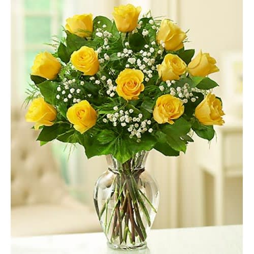 1 DOZEN YELLOW ROSES IN VASE WITH GREENS AND FILLER