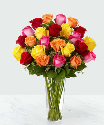 Colored Long Stem Roses. An arrangement by Select Flowers.