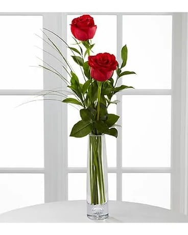 2 Red Roses Arranged in a Bud Vase. An arrangement by Sueppel's Flowers.