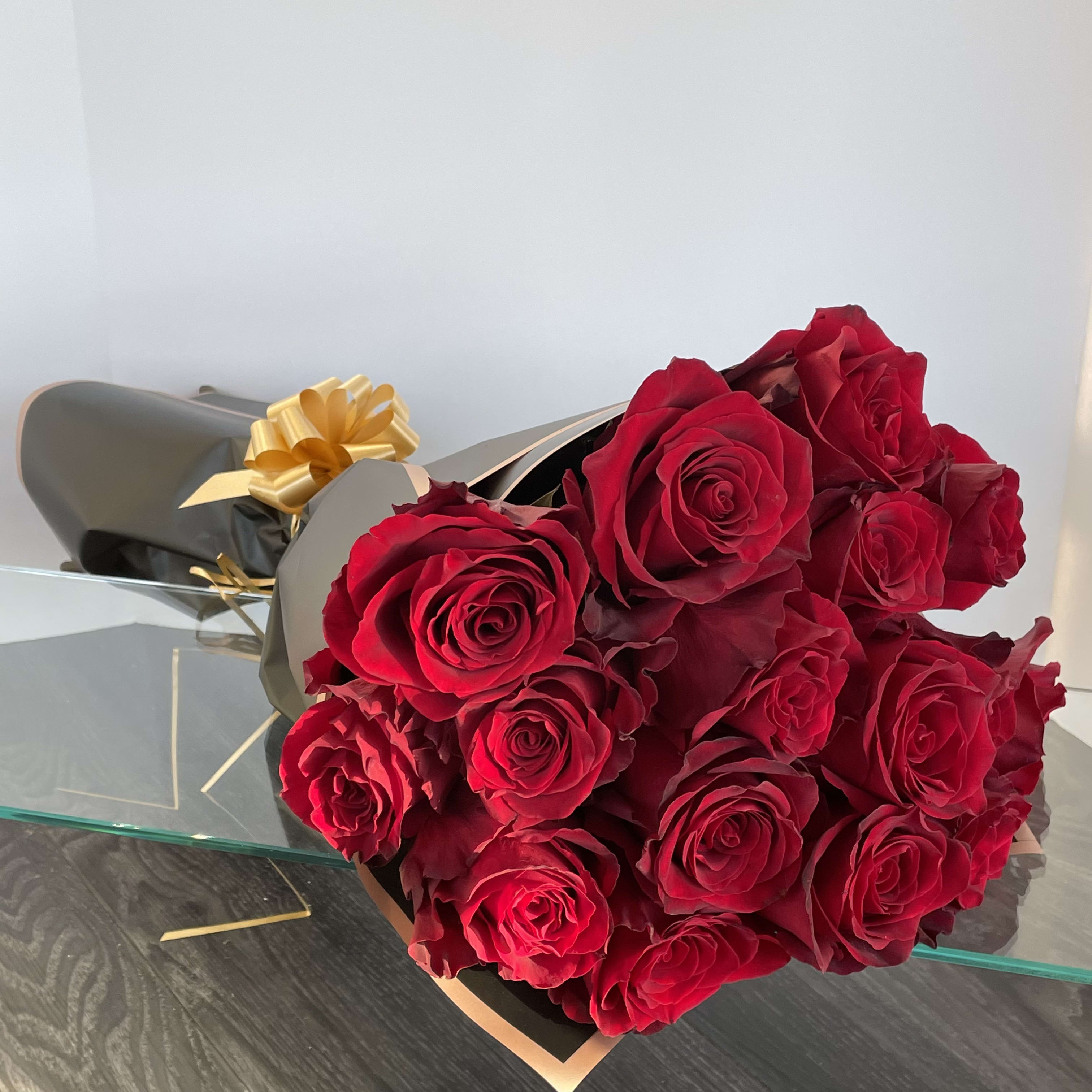 Deep Red Roses Bouquet. An arrangement by Violeta's Flower Shop.