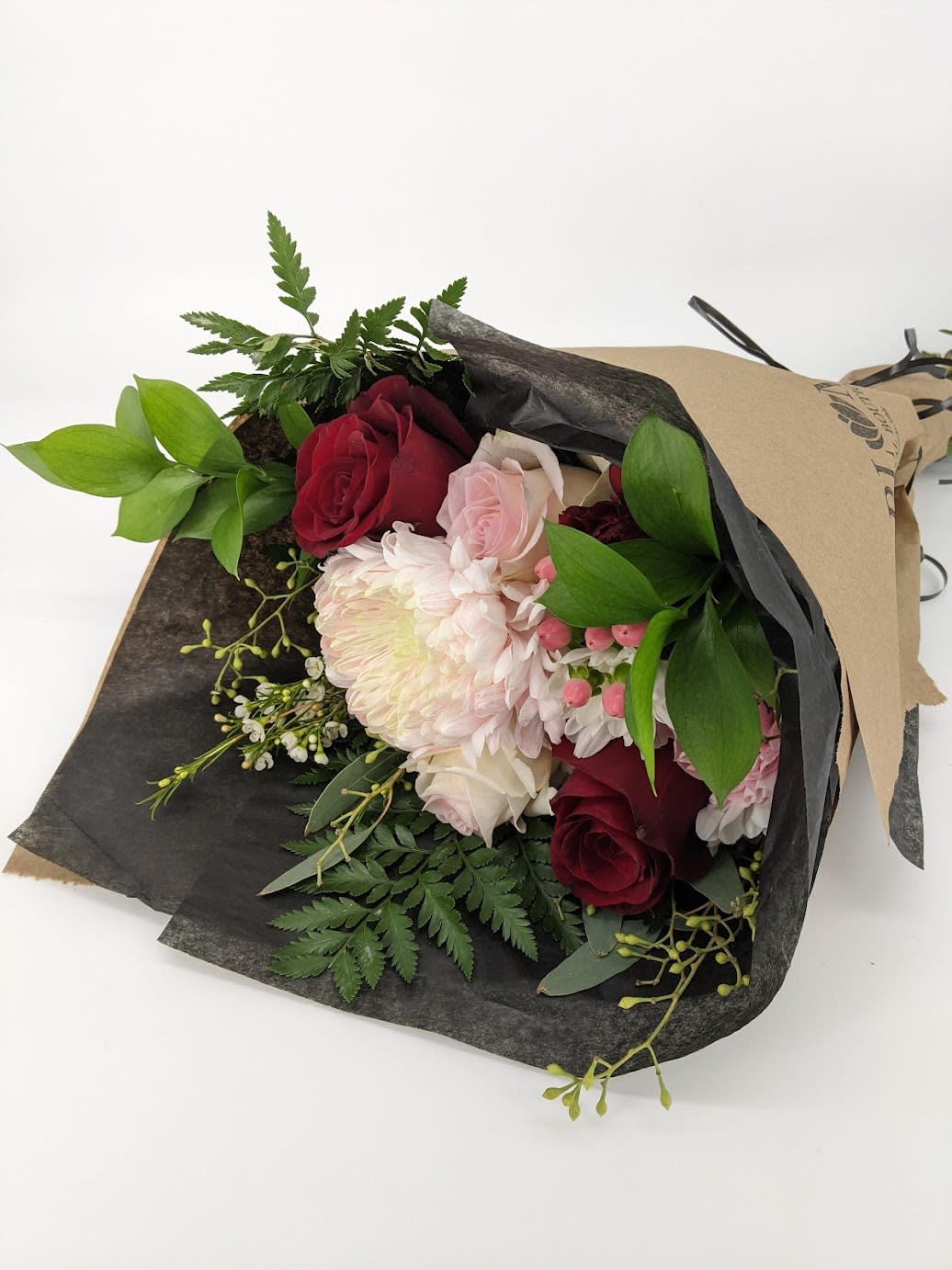 Blumz Wrapped Valentine's Day Bouquet. An arrangement by Blumz Floral Boutique.