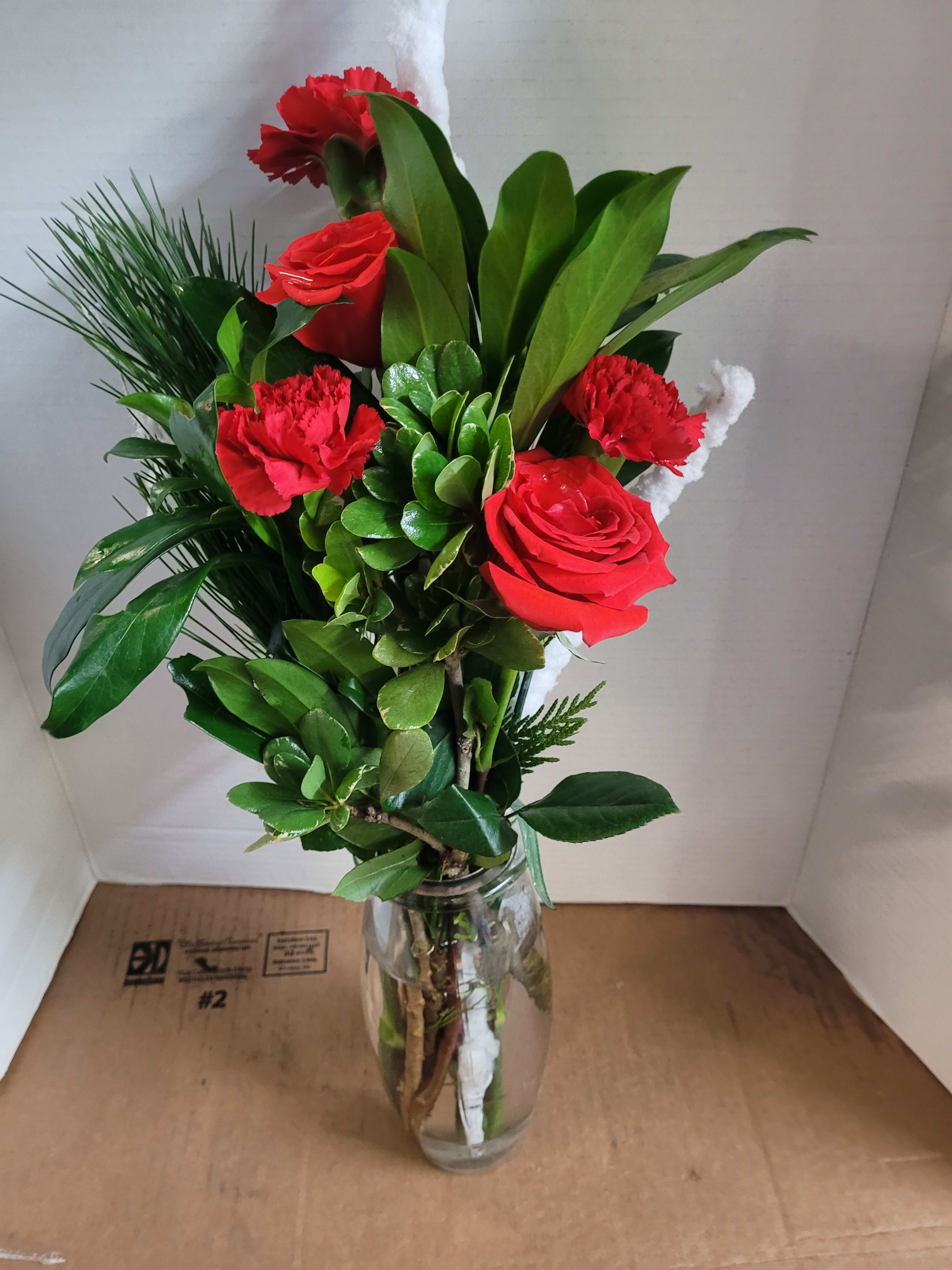 Shot of Red. An arrangement by Jane's Floral Dreams.